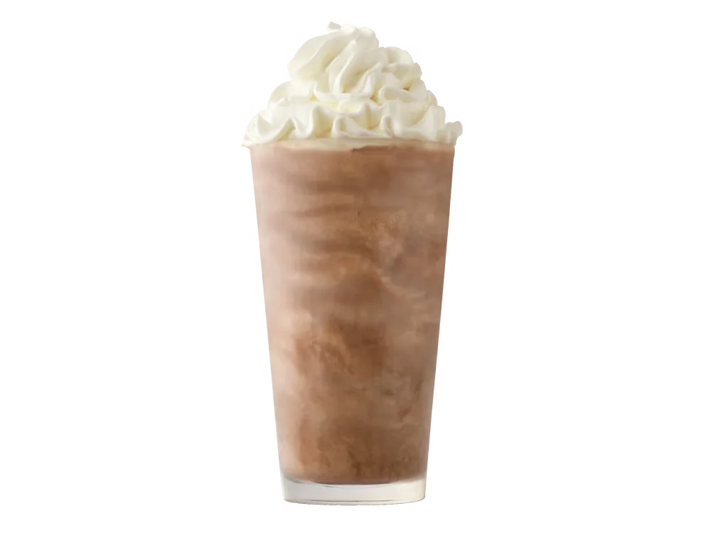 Arby’s Chocolate Shake in a clear cup topped with whipped cream