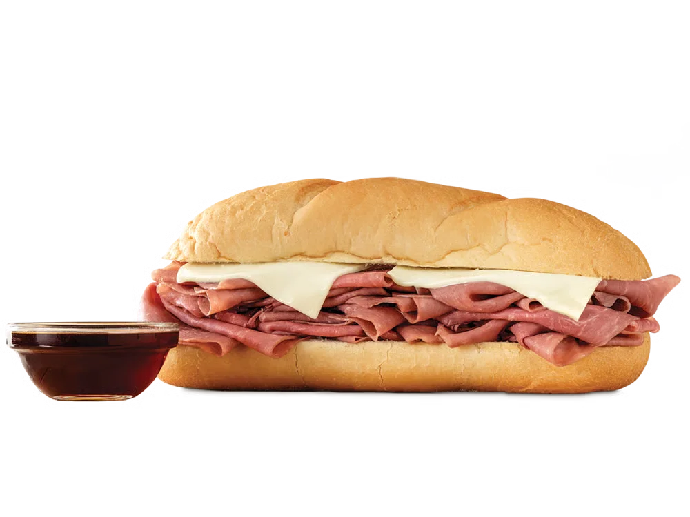 Arby’s Classic French Dip & Swiss sandwich with roast beef and Swiss cheese on a toasted sub roll, served with au jus