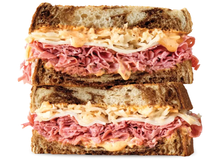 Arby’s Corned Beef Reuben sandwich with corned beef, sauerkraut, Swiss cheese, and Thousand Island dressing on marble rye
