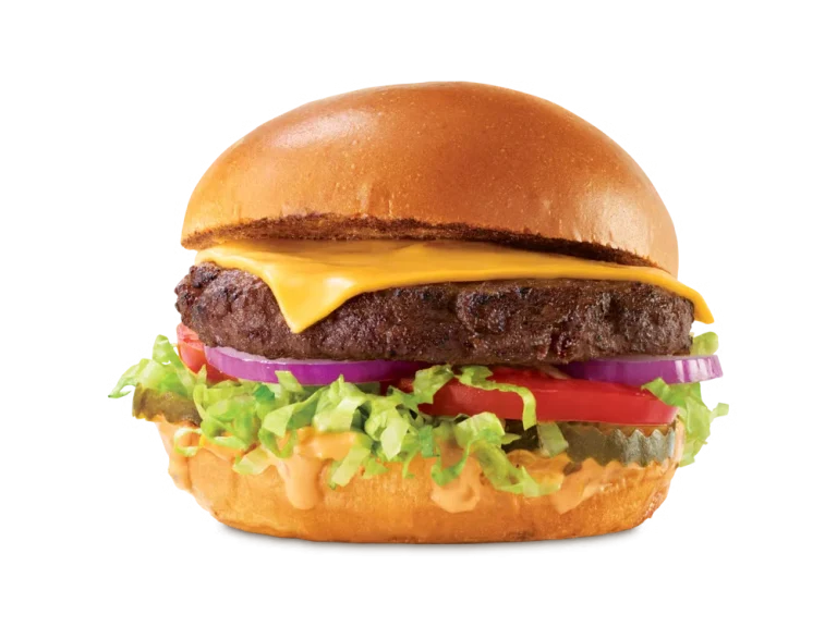 Arby’s Deluxe Burger with lettuce, tomato, pickles, and cheese on a toasted bun