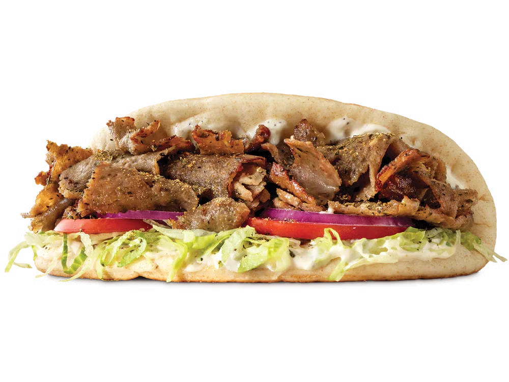 Arby’s Greek Gyro with sliced gyro meat, tzatziki sauce, lettuce, tomato, onion, and pita bread