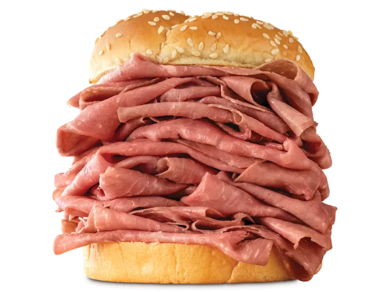 Arby’s Half Pound Roast Beef sandwich with extra layers of sliced roast beef on a sesame seed bun