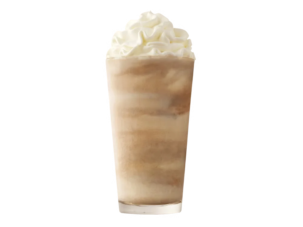 Arby’s Jamocha Shake in a clear cup topped with whipped cream