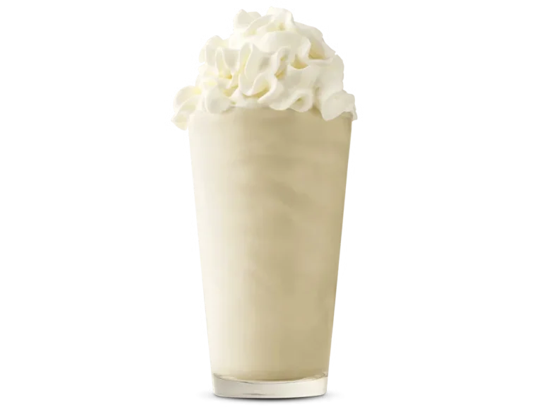 Arby’s Vanilla Shake in a clear cup topped with whipped cream