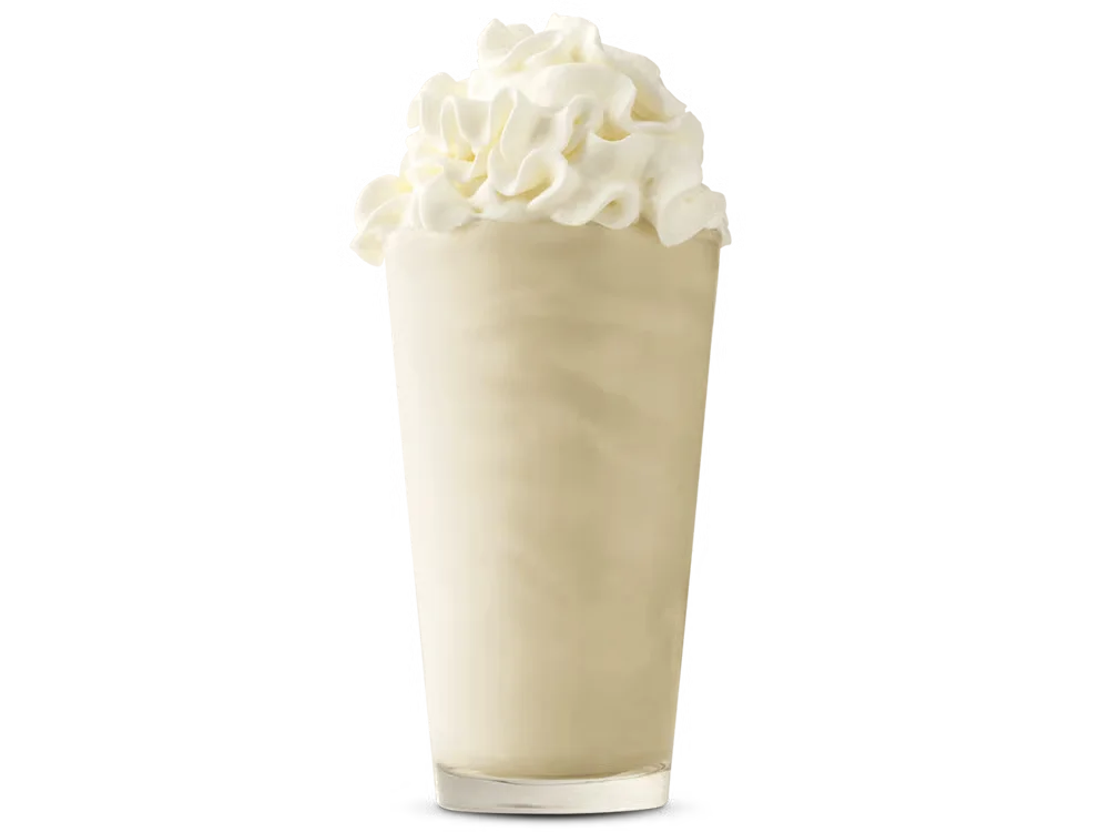 Arby’s Vanilla Shake in a clear cup topped with whipped cream